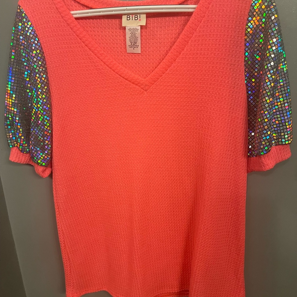 Never worn pink/fushia top with glittery sleeves.